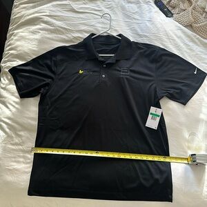 Black nike polo golf shirt with company logo. New with tags never worn
